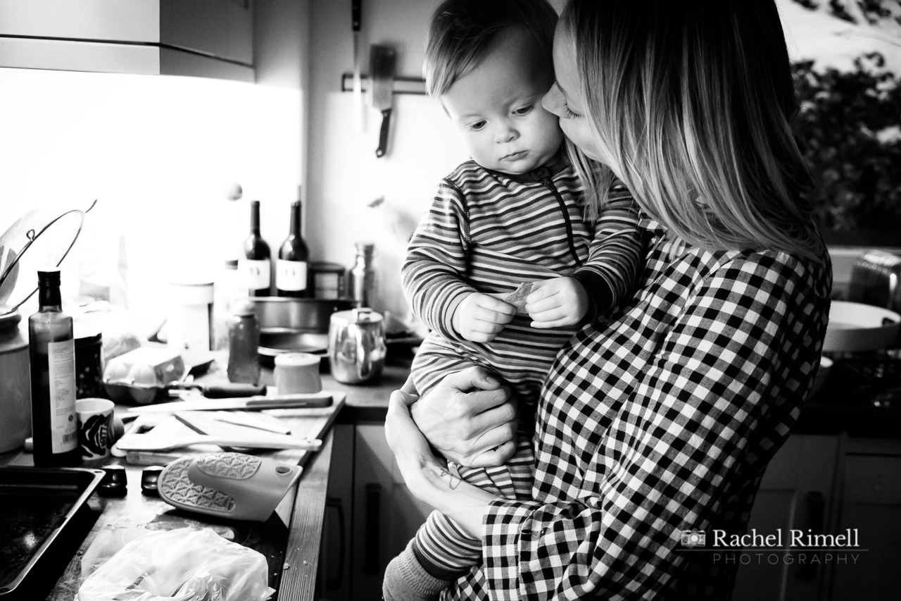 mother cuddles toddler documentary photo 