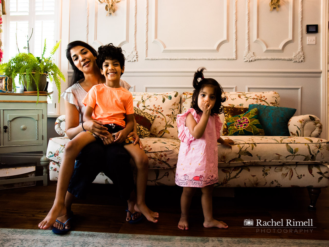 mother and children on their sofa at home family portrait