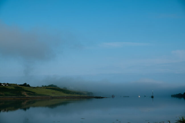 fine art landscape photography print - early morning mist over the sea at Skye with boats emerging from the mist