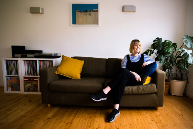 personal branding relaxed portrait of Janine Green Coaching on her sofa at home in natural light, Sydenham, London