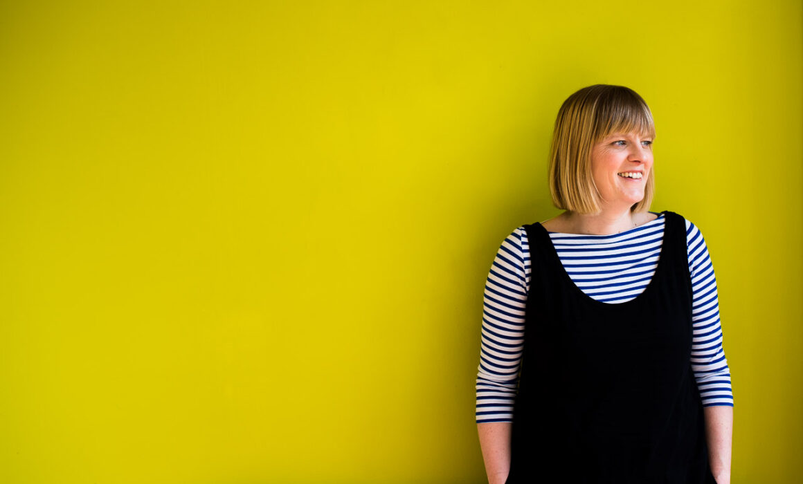 Colourful professional headshot of Janine Green Coach against lime green background, Crystal Palace, London