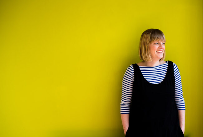Colourful professional headshot of Janine Green Coach against lime green background, Crystal Palace, London
