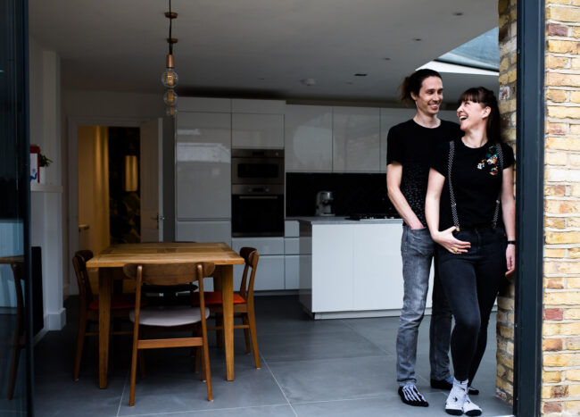 North Lonodn architects Studio Search standing outside one of their projects laughing on a personal branding environmental portrait photography session Haringey