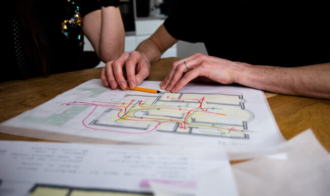 close up detail shot of architectural drawings as part of personal branding photography session for small business architects Studio Search in North London