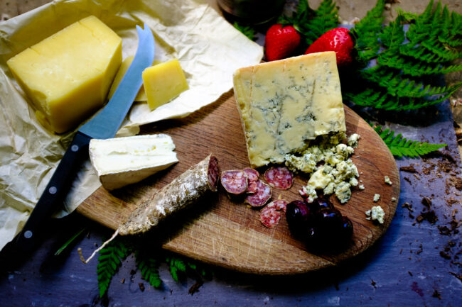 flat lay of cheese selection and salami. Creative food flat lay product photography in London