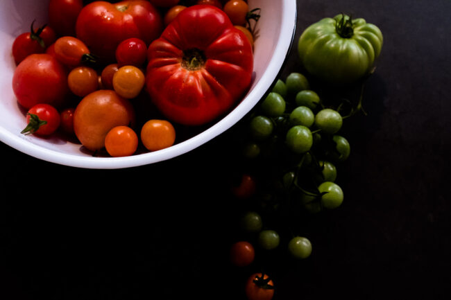 Detail photo of red and green tomatoes