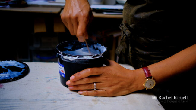 detail of textile artist stirring printing materials