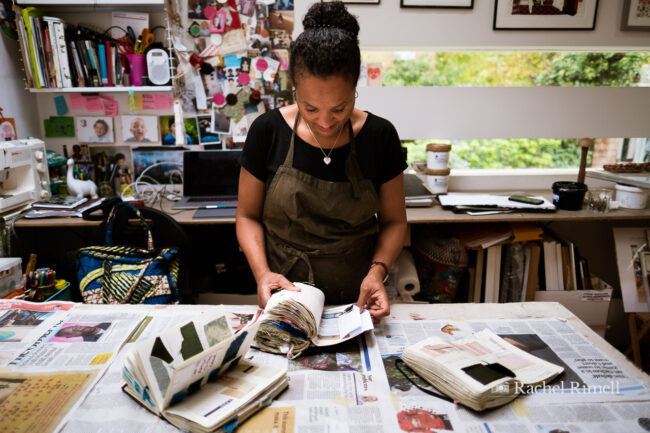 environmnetal personal branding portrait of Crystal Palace textile artist Emma Walker in her studio with fabric sample books
