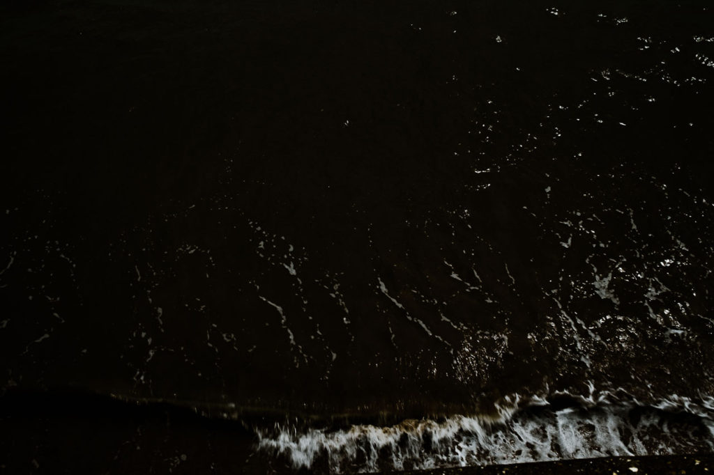 Sea spray splashing against the wall in Filey, North Yorkshire 