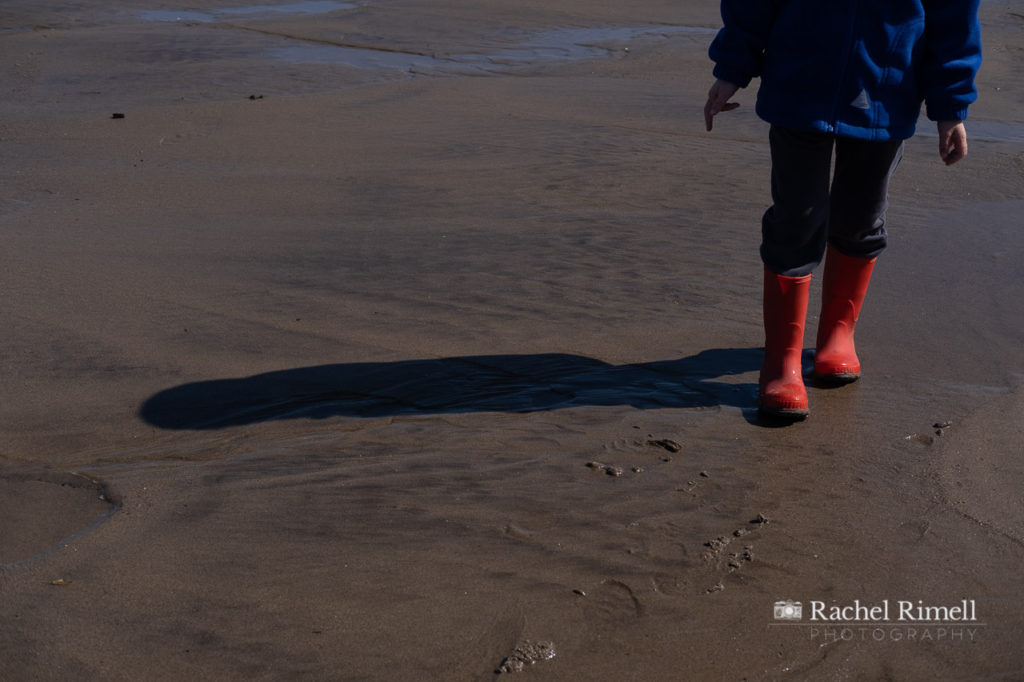 red wellington boots on Whitby beach